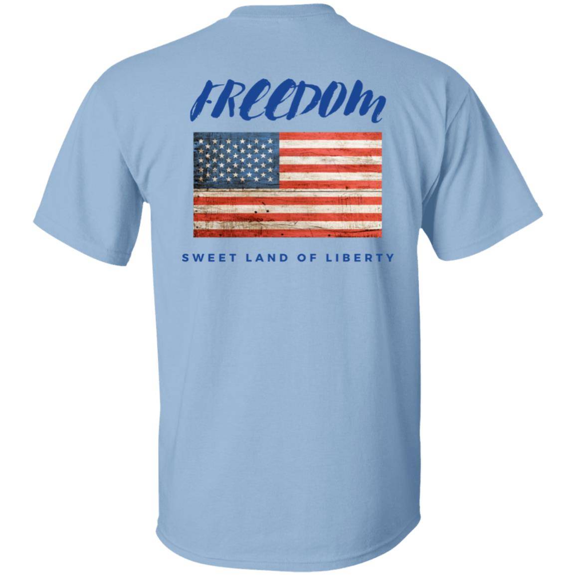 Light blue, heavyweight classic unisex t-shirt in 100% cotton. Freedom is written across the chest back with a grunge American flag below it and written beneath that is Sweet Land of Liberty.