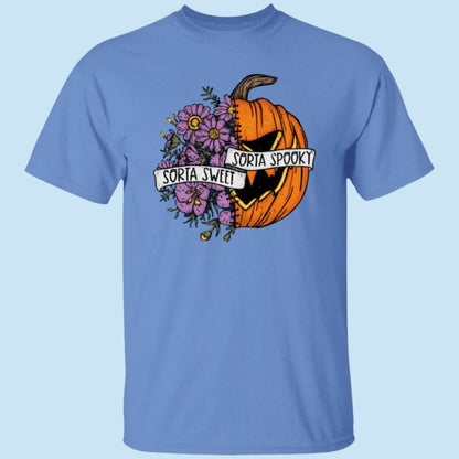 Carolina blue unisex t-shirt. with a Halloween image on the chest, half of which are flowers while the other half is a scary pumpkin. A ribbon is wrapped around the image, reading, Sorta Sweet, Sorta Spooky - Any Gift For You