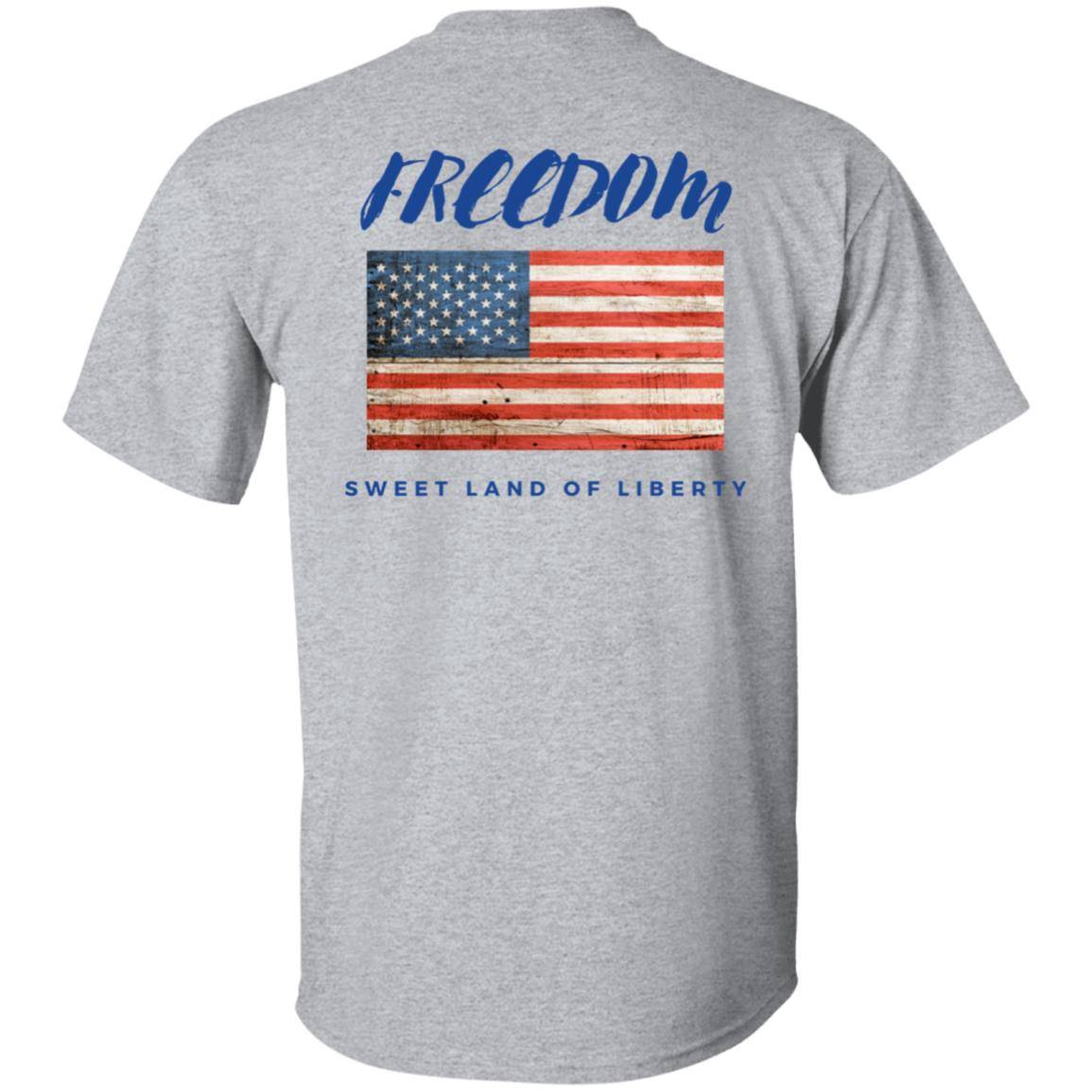 Sport gray, heavyweight classic unisex t-shirt in 100% cotton. Freedom is written across the chest back with a grunge American flag below it and written beneath that is Sweet Land of Liberty.