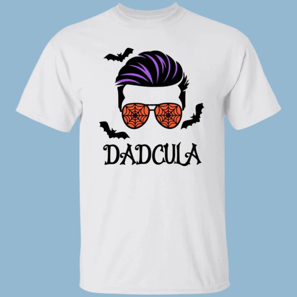 White unisex Halloween t-shirt with an image of a cool-looking man’s face on the front wearing orange ray-ban sunglasses covered in cob webs with bats flying around his head. D a d c u l a, Dadcula, is printed beneath