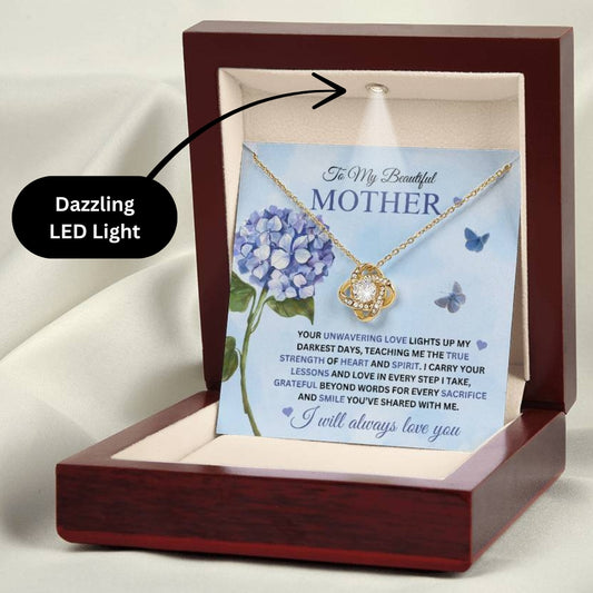 Love Knot Necklace for Mom - I Carry Your Love and Lessons in Every Step in 18k gold finish on a blue  message card showing a blue hydrangea, in a mahogany style gift box with a dazzling LED light - Any Gift For You