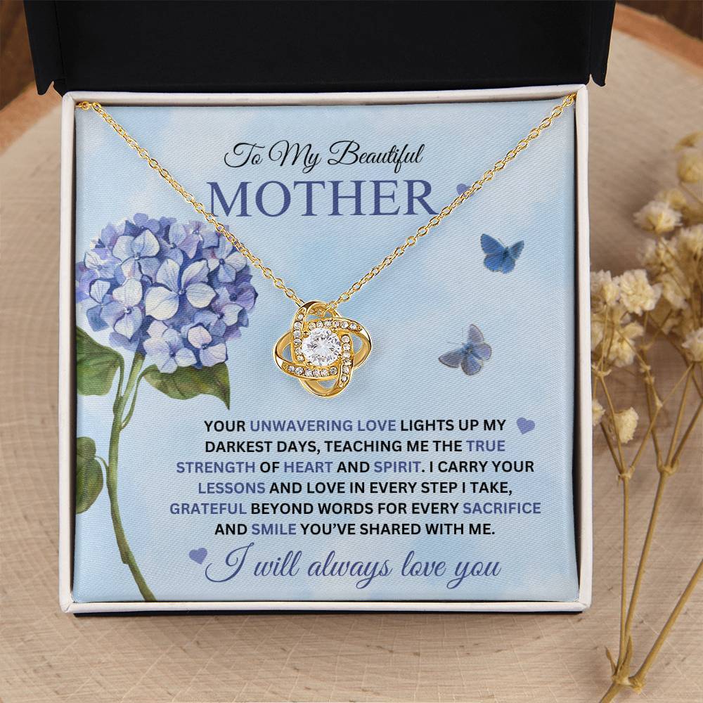 Love Knot Necklace for Mom - I Carry Your Love and Lessons in Every Step in 18k gold finish on a blue  message card showing a blue hydrangea, in a soft touch gift box - Any Gift For You